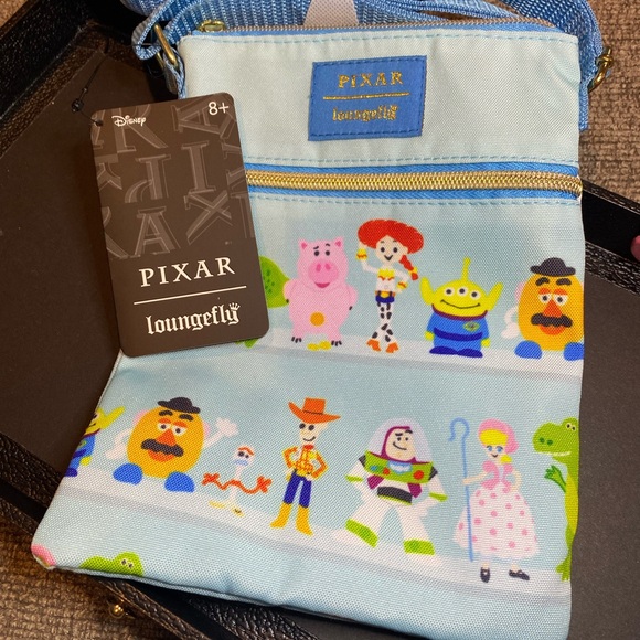 Disney Handbags - Disney Pixar Loungefly Crossbody bag, Toy Story with all your favorites, NWT